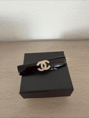 CHANEL Black Resin Hair Clip with Gold Crystal CC Logo